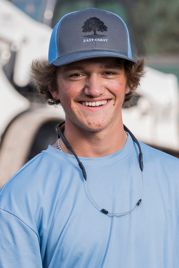 Brian, landscaping crew member at East Coast Consolidated Landscaping, helping maintain healthy landscapes and professionally managed outdoor spaces.