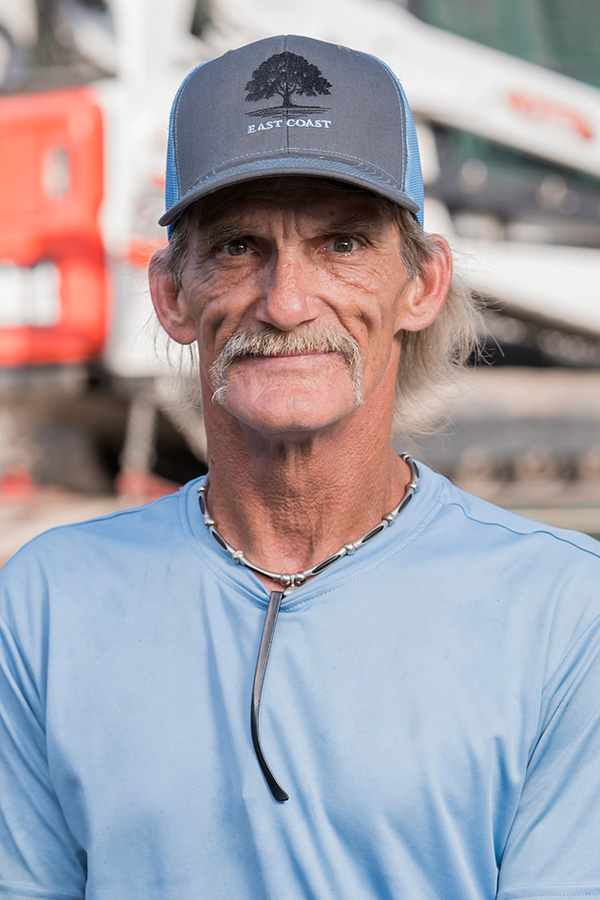 Lucky, experienced landscaping crew member at East Coast Consolidated Landscaping, supporting lawn care, landscape maintenance, and outdoor property improvements.