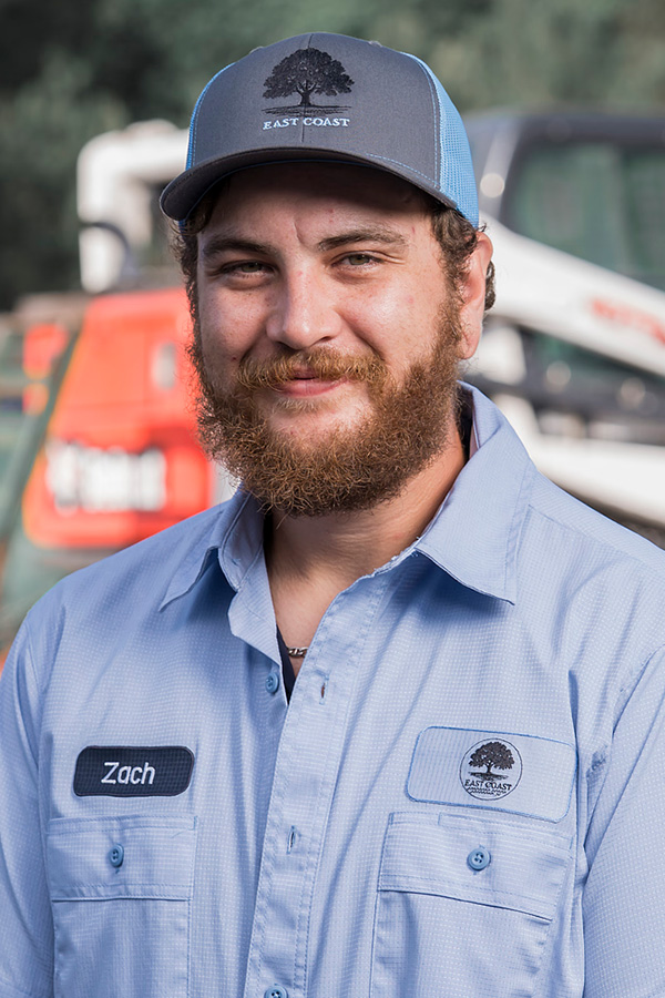 Zach, landscaping professional at East Coast Consolidated Landscaping, providing quality lawn care, landscape installation, and property maintenance.