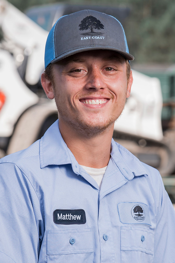 Matthew, landscaping technician at East Coast Consolidated Landscaping, helping maintain beautiful outdoor spaces through reliable lawn care and landscape services.